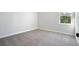 Simple bedroom with gray carpeting and neutral walls at 300 Chapman Cir, Goose Creek, SC 29445