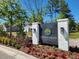 Community entrance with landscaped grounds and signage at 263 Darby Meadow Ln, Ridgeville, SC 29472