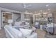Open living room featuring a cozy seating area and a view into the kitchen at 263 Darby Meadow Ln, Ridgeville, SC 29472