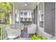 Relaxing front porch with wicker seating and a ceiling fan at 805 Tupelo Bay Dr, Mount Pleasant, SC 29464
