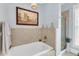 Bathroom with a bathtub, shower, and decorative artwork at 805 Tupelo Bay Dr, Mount Pleasant, SC 29464