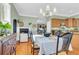 Spacious dining area with hardwood floors, a large table and access to kitchen at 805 Tupelo Bay Dr, Mount Pleasant, SC 29464