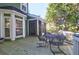 Relaxing deck features a metal table and chairs, and overlooks a private backyard at 794 Hunt Club Run, Charleston, SC 29414