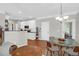 Casual dining area with glass table and chairs, adjacent to kitchen at 794 Hunt Club Run, Charleston, SC 29414