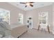 Charming bedroom with a queen bed, workspace, and two windows at 794 Hunt Club Run, Charleston, SC 29414