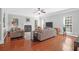 Spacious living room with hardwood floors, fireplace, and ample natural light at 794 Hunt Club Run, Charleston, SC 29414