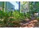Landscaped backyard with stone pathway and green foliage at 794 Hunt Club Run, Charleston, SC 29414