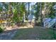 Private backyard with a grassy area, wooden fence, and stone path at 794 Hunt Club Run, Charleston, SC 29414