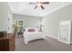 Spacious bedroom with a king-size bed and large windows at 794 Hunt Club Run, Charleston, SC 29414