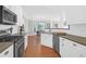 Modern kitchen with white cabinets, stainless steel appliances, and a large island at 794 Hunt Club Run, Charleston, SC 29414