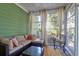 Relaxing screened porch with comfortable seating and large windows at 794 Hunt Club Run, Charleston, SC 29414