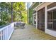 Spacious deck with seating area, offering views of the wooded backyard at 794 Hunt Club Run, Charleston, SC 29414
