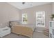 Cozy bedroom with a full bed, built-in shelving, and large windows at 794 Hunt Club Run, Charleston, SC 29414