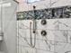 Modern shower with marble tile, glass enclosure, and rainfall shower head at 4566 Durant Ave, North Charleston, SC 29405