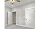 Grey bedroom with carpet, ceiling fan, and two closets at 4566 Durant Ave, North Charleston, SC 29405