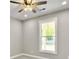 Bedroom with grey walls, carpet, ceiling fan, and window at 4566 Durant Ave, North Charleston, SC 29405