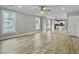 Open living room with hardwood floors and kitchen view at 4566 Durant Ave, North Charleston, SC 29405