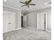 Spacious bedroom with grey walls, carpet, and double doors at 4566 Durant Ave, North Charleston, SC 29405