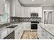 Modern kitchen with stainless steel appliances and granite countertops at 4566 Durant Ave, North Charleston, SC 29405