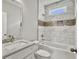 Modern bathroom with marble tile and granite vanity at 4566 Durant Ave, North Charleston, SC 29405