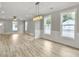 Spacious dining room with hardwood floors and chandelier at 4566 Durant Ave, North Charleston, SC 29405