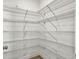 Walk-in pantry with ample shelving for storage at 4566 Durant Ave, North Charleston, SC 29405
