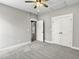 Bedroom with grey walls, carpet, ceiling fan, and closets at 4566 Durant Ave, North Charleston, SC 29405