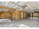 Unfinished garage with concrete floor and ample storage at 1008 Mariners Cay Dr, Folly Beach, SC 29439