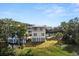 Two-story home with attached garage and waterfront lot at 1008 Mariners Cay Dr, Folly Beach, SC 29439