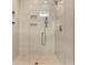 Walk-in shower with pebble floor and frameless glass at 1008 Mariners Cay Dr, Folly Beach, SC 29439