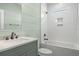 Clean bathroom with white tile, a bathtub, and a vanity at 1008 Mariners Cay Dr, Folly Beach, SC 29439