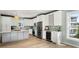 Modern kitchen with stainless steel appliances and white cabinets at 1008 Mariners Cay Dr, Folly Beach, SC 29439