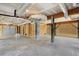 Unfinished garage with concrete floor and partial walls at 1008 Mariners Cay Dr, Folly Beach, SC 29439