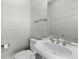 Simple bathroom with white pedestal sink and toilet at 1008 Mariners Cay Dr, Folly Beach, SC 29439