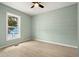 Light and airy bedroom with light walls and wood flooring at 1008 Mariners Cay Dr, Folly Beach, SC 29439