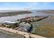 Aerial view of waterfront home and community at 1008 Mariners Cay Dr, Folly Beach, SC 29439