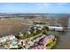 Aerial view of waterfront community with tennis courts and lush landscaping at 1008 Mariners Cay Dr, Folly Beach, SC 29439