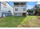 Home with double garage and grassy yard at 1008 Mariners Cay Dr, Folly Beach, SC 29439