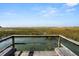 Wooden deck overlooking tranquil marsh views at 1008 Mariners Cay Dr, Folly Beach, SC 29439