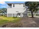 Elevated home with gray siding and a spacious yard at 1008 Mariners Cay Dr, Folly Beach, SC 29439