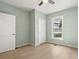 Bedroom with light green walls, wood flooring, and white doors at 1008 Mariners Cay Dr, Folly Beach, SC 29439