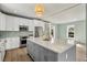 Spacious kitchen featuring white cabinets, stainless steel appliances, and a large island at 1008 Mariners Cay Dr, Folly Beach, SC 29439