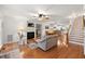 Living room with hardwood floors, fireplace, and access to deck at 413 E Indian Ave, Folly Beach, SC 29439