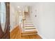 Elegant entryway with hardwood floors, staircase, and recessed shelving at 5250 Timber Race Crse, Hollywood, SC 29449