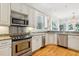 Modern kitchen with granite counters and stainless steel appliances at 5250 Timber Race Crse, Hollywood, SC 29449