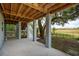 Covered patio, stairs to backyard, and view of marsh at 5250 Timber Race Crse, Hollywood, SC 29449