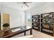 Bright home office with built-in shelving and hardwood floors at 5250 Timber Race Crse, Hollywood, SC 29449
