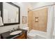 Bathroom with a shower/tub combo and dark vanity at 5250 Timber Race Crse, Hollywood, SC 29449