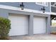 Two-car garage with white doors at 5250 Timber Race Crse, Hollywood, SC 29449
