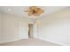 Spacious bedroom with neutral walls, ceiling fan, and two closets at 5250 Timber Race Crse, Hollywood, SC 29449